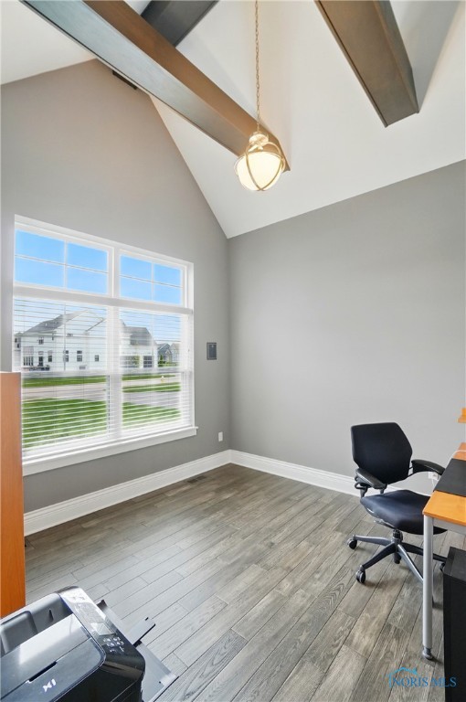office with wood finished floors, baseboards, beam ceiling, and high vaulted ceiling