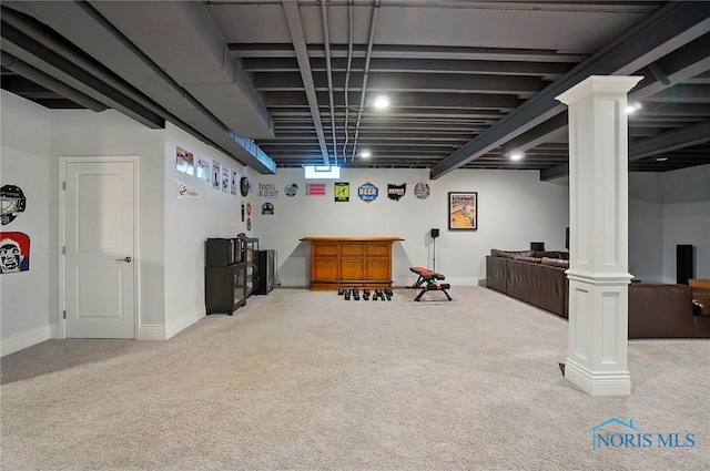 below grade area with carpet floors, baseboards, and bar area