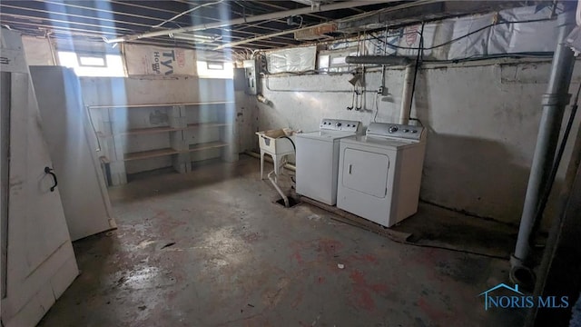 below grade area with washing machine and dryer and plenty of natural light