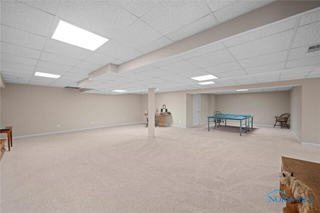 playroom with baseboards, a paneled ceiling, and carpet