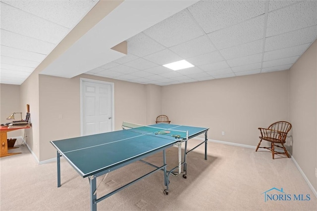 playroom featuring carpet, baseboards, and a paneled ceiling