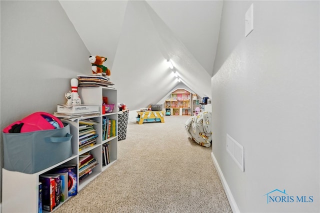 game room with carpet flooring, visible vents, and vaulted ceiling