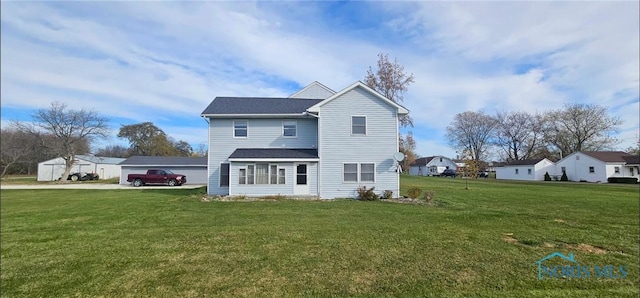 back of property with a yard