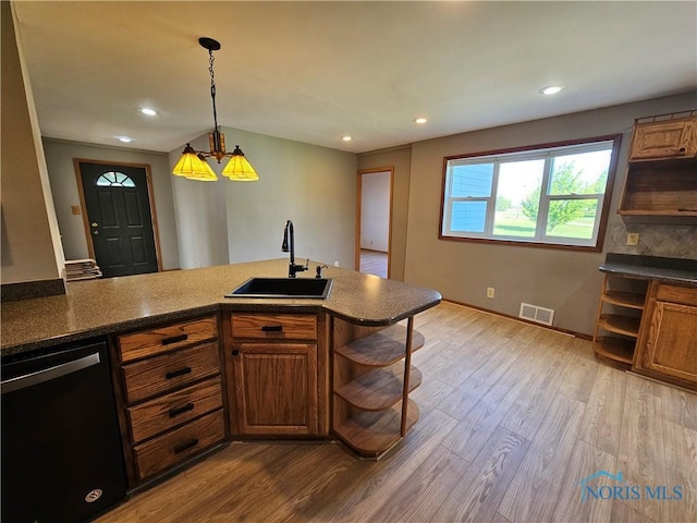 23675 W State Route 51, Genoa, OH 43430 - kitchen featuring open shelves, a sink, dishwasher, brown cabinetry, and recessed lighting