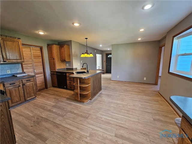 23675 W State Route 51, Genoa, OH 43430 - kitchen featuring dishwasher, open shelves, a sink, a peninsula, and dark countertops