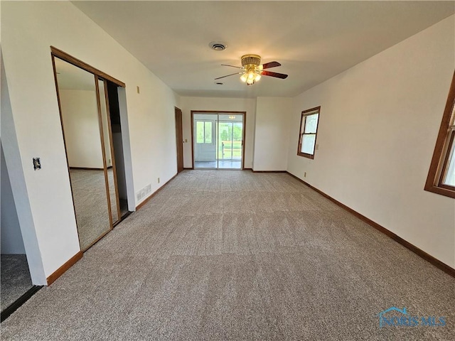 23675 W State Route 51, Genoa, OH 43430 - empty room featuring light colored carpet, a ceiling fan, and baseboards
