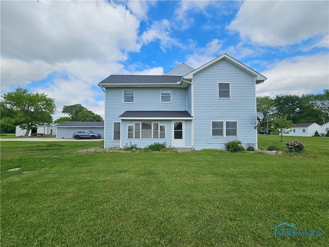 23675 W State Route 51, Genoa, OH 43430 - rear view of house featuring a yard