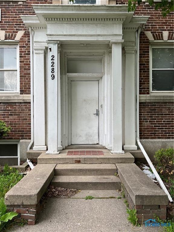 2289 Upton Ave, Toledo, OH 43606 - property entrance with brick siding