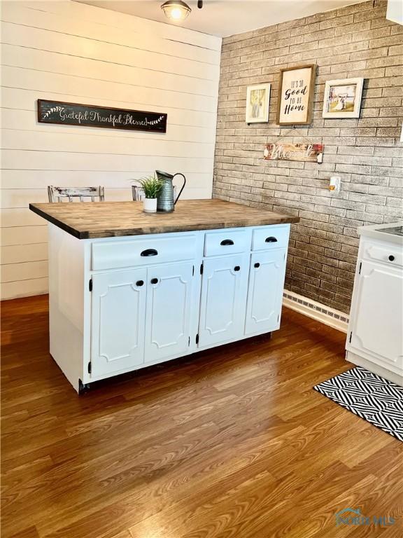 12982 State Route 34, Bryan, OH 43506 - bar with brick wall, dark wood finished floors, and wooden walls