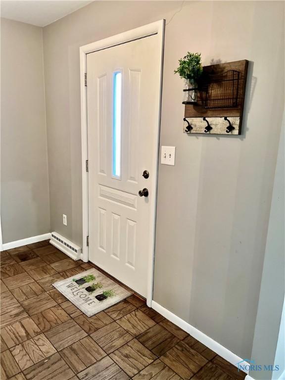 12982 State Route 34, Bryan, OH 43506 - entrance foyer with baseboards and baseboard heating