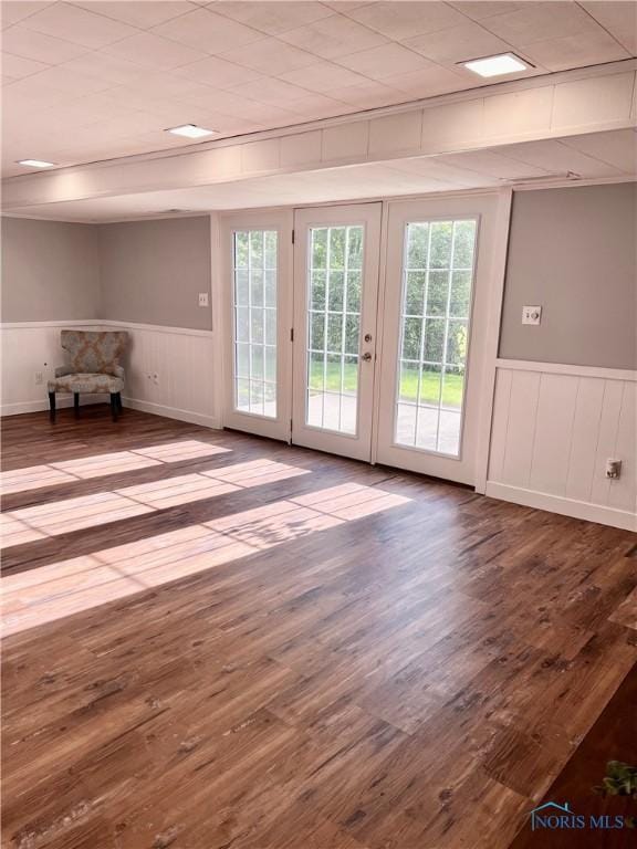 12982 State Route 34, Bryan, OH 43506 - doorway to outside with plenty of natural light, wainscoting, wood finished floors, and french doors