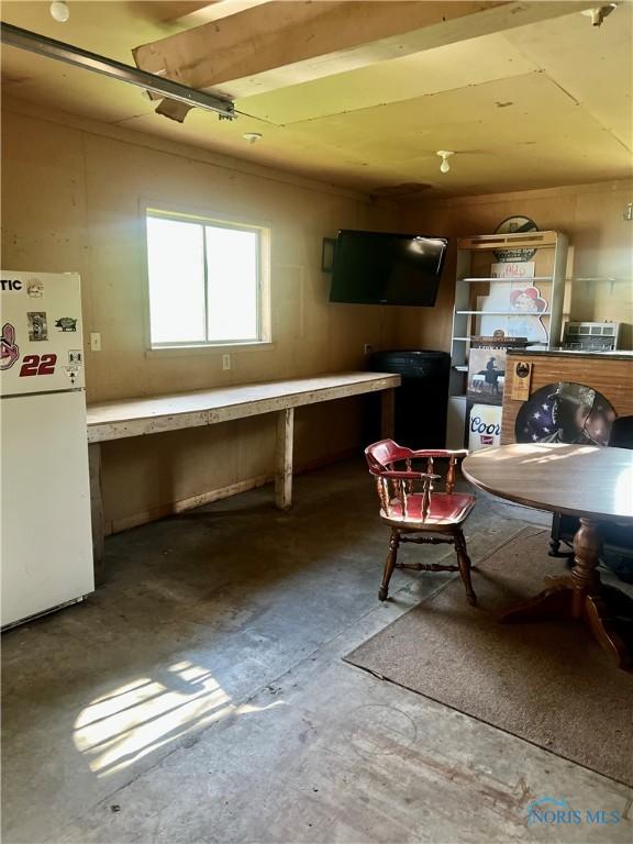 12982 State Route 34, Bryan, OH 43506 - kitchen featuring freestanding refrigerator and unfinished concrete flooring