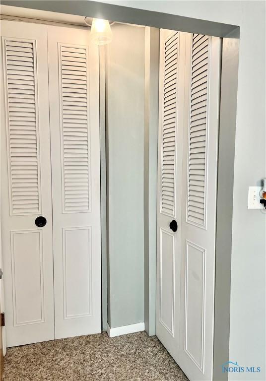 12982 State Route 34, Bryan, OH 43506 - detailed view of carpet flooring and baseboards