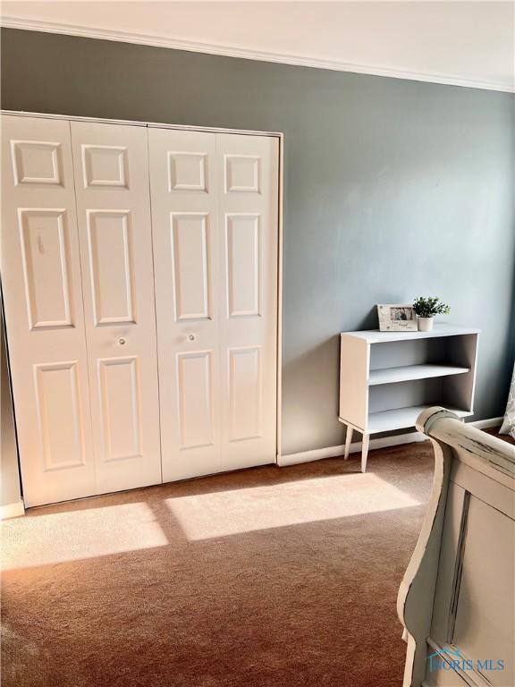 12982 State Route 34, Bryan, OH 43506 - carpeted bedroom with crown molding and baseboards