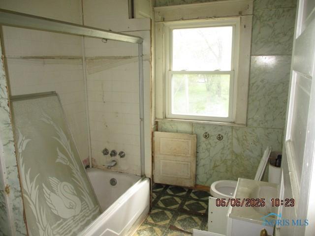 bathroom featuring vanity and shower / tub combo