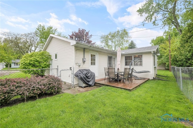 back of property featuring a deck
