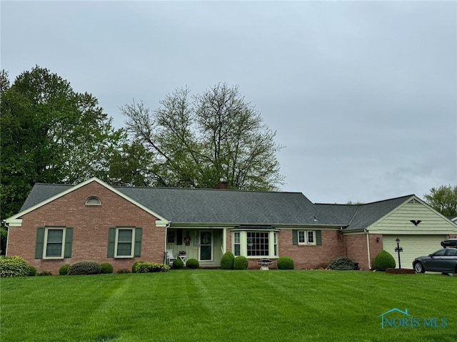 single story home with a front lawn, brick siding, roof with shingles, and a garage