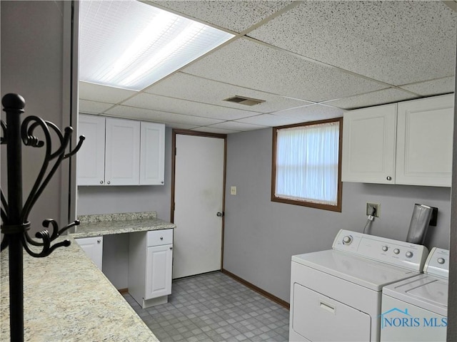 13941 Hannah Rd, Bowling Green, OH 43402 - washroom with cabinet space, washer and dryer, baseboards, and light flooring