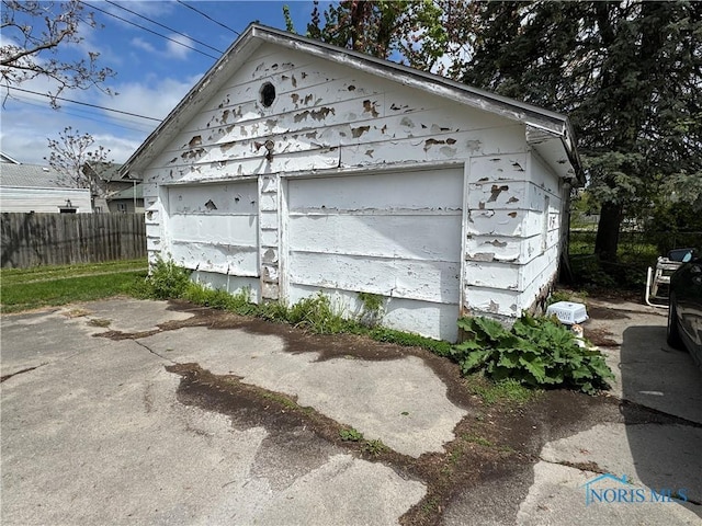 detached garage with fence
