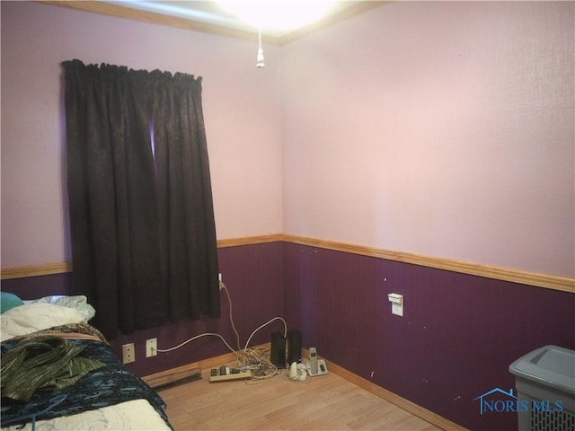 1390 Ayersville Ave, Defiance, OH 43512 - bedroom with a wainscoted wall and wood finished floors