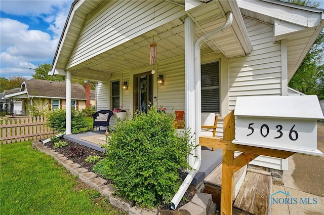 5036 Trellis Way, Sylvania, OH 43560 - view of exterior entry featuring covered porch and fence