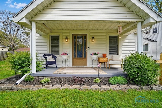 5036 Trellis Way, Sylvania, OH 43560 - doorway to property featuring a porch and fence