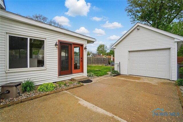 5036 Trellis Way, Sylvania, OH 43560 - entrance to property with driveway, fence, and a garage