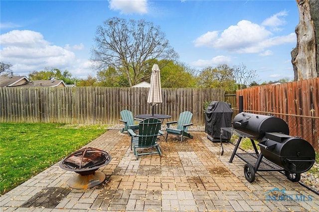 5036 Trellis Way, Sylvania, OH 43560 - view of patio / terrace with a fire pit and a grill