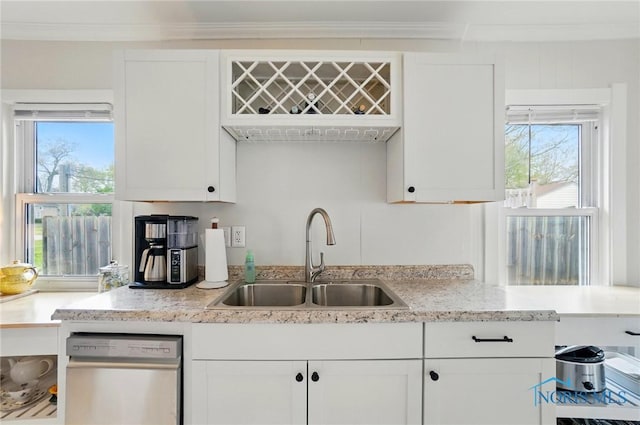 5036 Trellis Way, Sylvania, OH 43560 - kitchen featuring stainless steel dishwasher, a sink, white cabinets, healthy amount of natural light, and crown molding