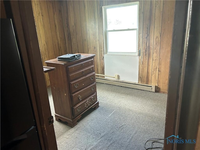 interior space with a baseboard radiator and carpet