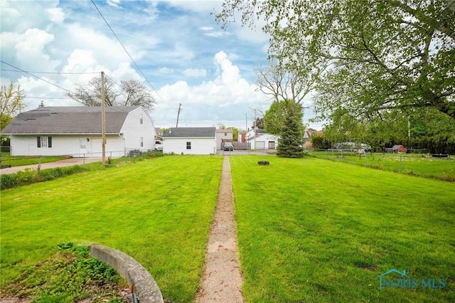 view of yard featuring fence