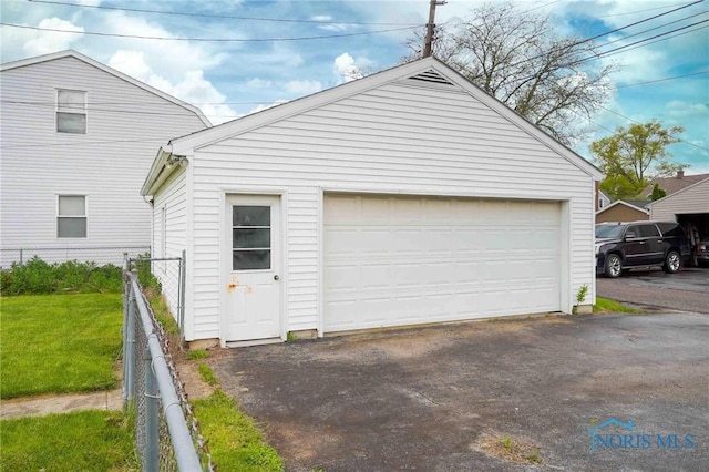 detached garage with fence