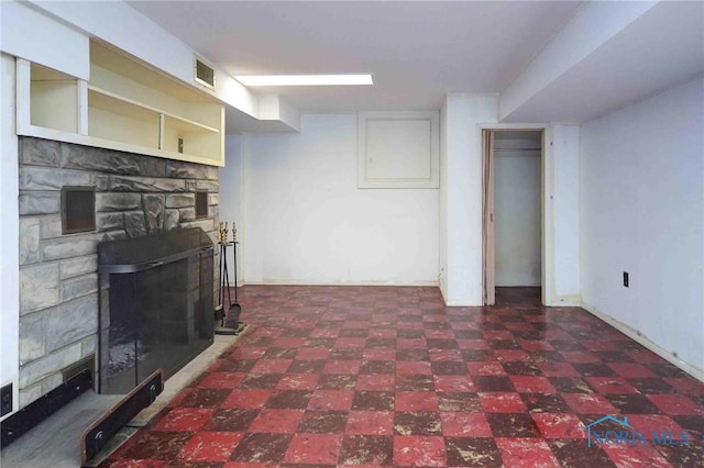 living area featuring tile patterned floors and visible vents