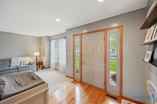 entrance foyer with plenty of natural light, visible vents, baseboards, and recessed lighting