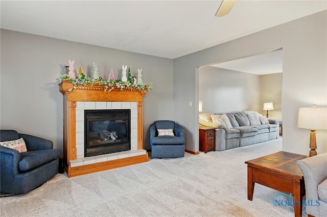 living room featuring a fireplace and carpet floors