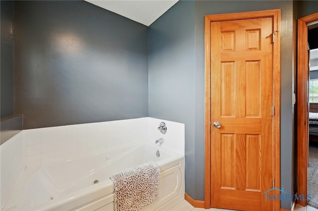 clothes washing area featuring baseboards