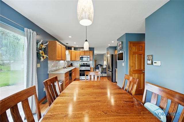 dining space with light wood-style floors