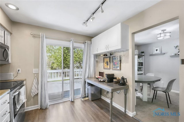 250 Southwood Dr, Perrysburg, OH 43551 - kitchen featuring track lighting, white cabinetry, light countertops, baseboards, and appliances with stainless steel finishes