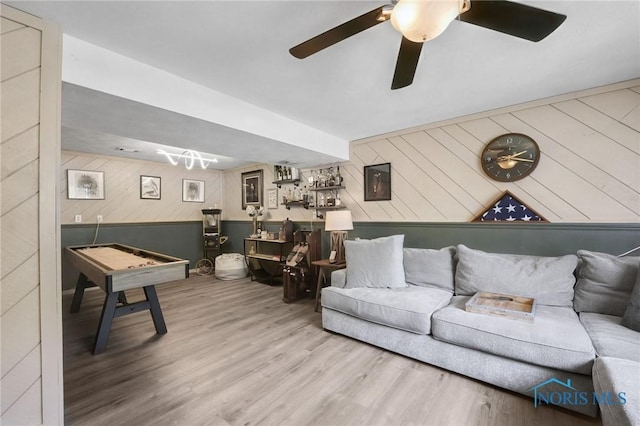250 Southwood Dr, Perrysburg, OH 43551 - living room with a ceiling fan, wooden walls, and wood finished floors