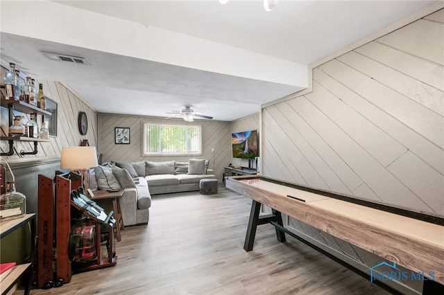 250 Southwood Dr, Perrysburg, OH 43551 - rec room featuring wood walls, a ceiling fan, visible vents, and wood finished floors