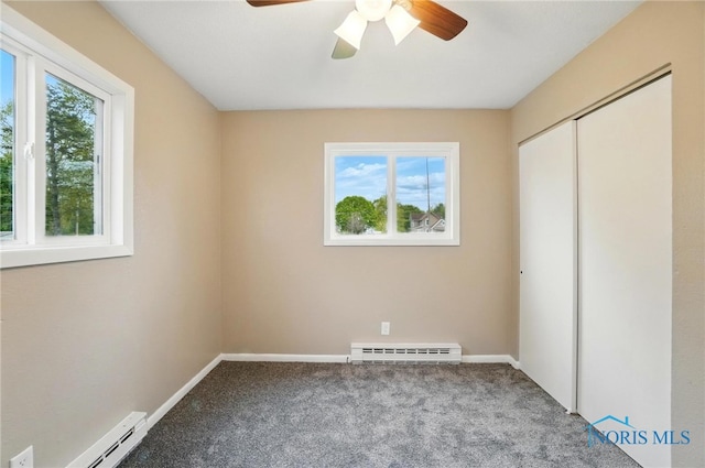 20161 Locust St, Weston, OH 43569 - unfurnished bedroom with multiple windows, a baseboard radiator, baseboard heating, and carpet floors