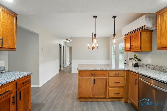 20161 Locust St, Weston, OH 43569 - kitchen featuring a wall mounted AC, stainless steel dishwasher, a peninsula, brown cabinets, and light wood-style floors