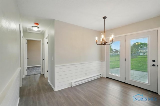 20161 Locust St, Weston, OH 43569 - unfurnished dining area featuring a baseboard radiator, a notable chandelier, and wood finished floors