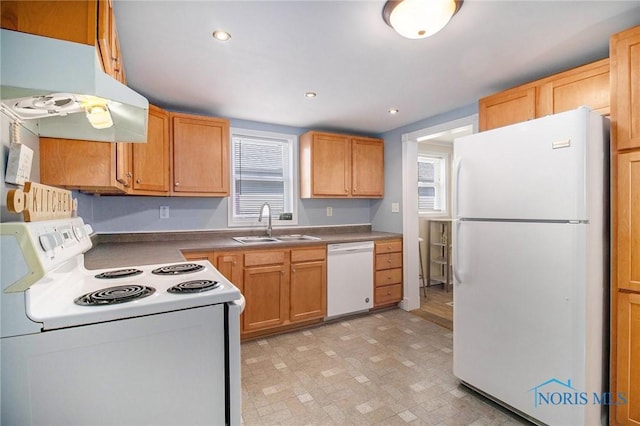 910 E High St, Bryan, OH 43506 - kitchen featuring white appliances, range hood, a sink, recessed lighting, and dark countertops