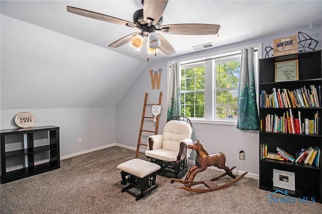910 E High St, Bryan, OH 43506 - sitting room with ceiling fan, lofted ceiling, carpet flooring, and baseboards