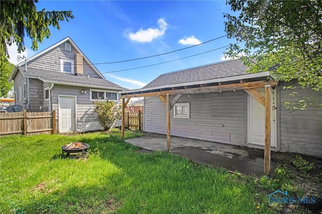 910 E High St, Bryan, OH 43506 - view of yard with an outdoor fire pit