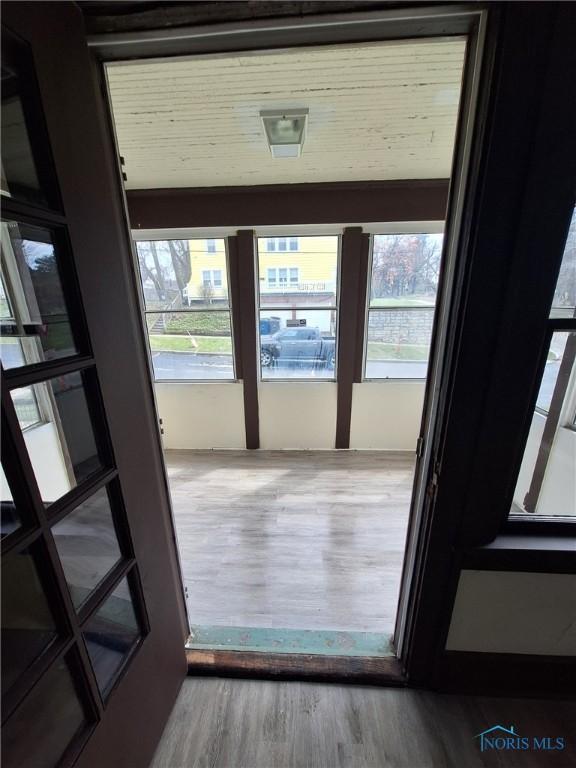doorway featuring wood finished floors