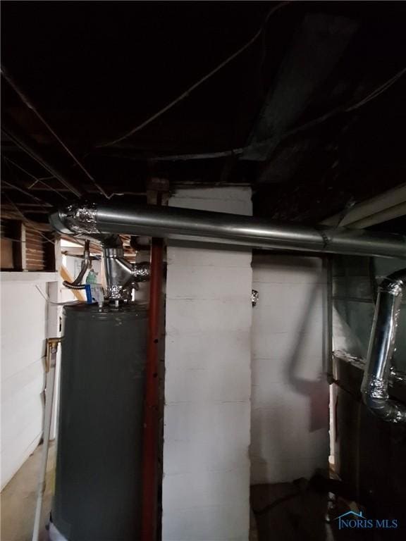 unfinished basement with gas water heater