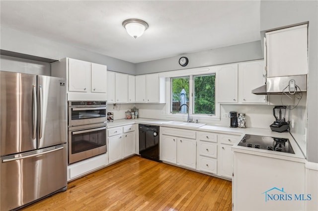 kitchen featuring black appliances, a sink, under cabinet range hood, and white cabinetry