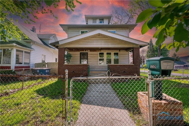 532 Dover Pl, Toledo, OH 43605 - american foursquare style home with a gate, covered porch, and brick siding